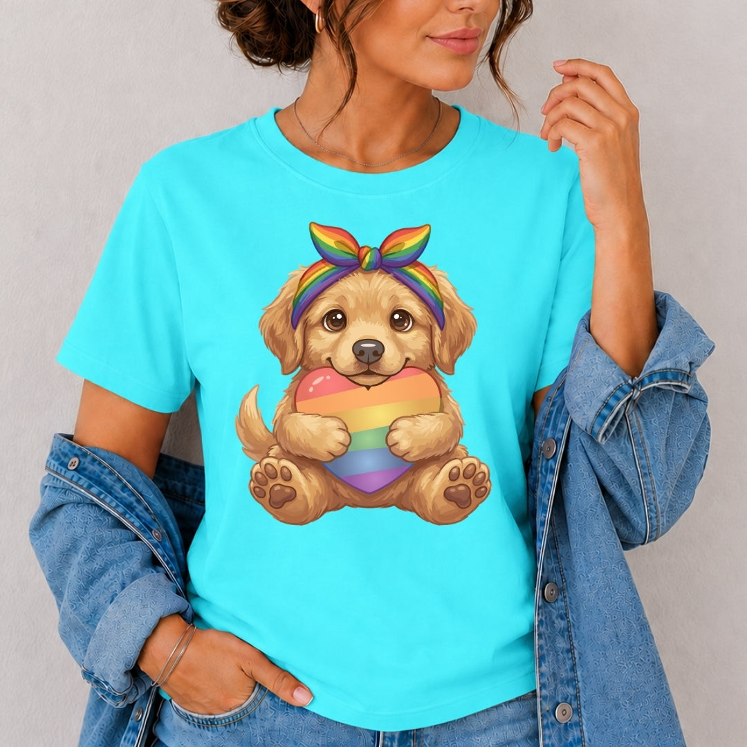 Person wearing a turquoise t-shirt with a dog holding a rainbow heart design.