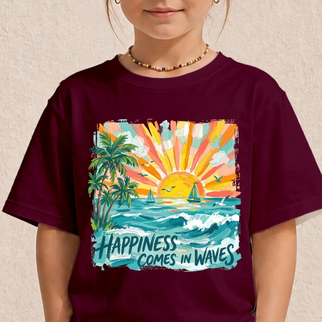 A child wearing a dark maroon t-shirt with a colorful graphic of a tropical sunset, palm trees, and waves with the text 'HAPPINESS COMES IN WAVES'.