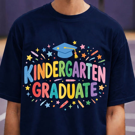 Navy blue t-shirt with colorful 'Kindergarten Graduate' text and graphics.