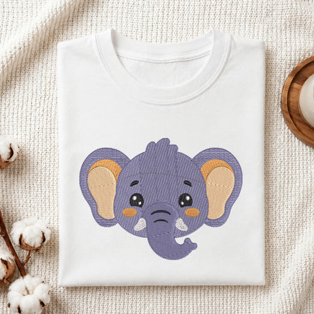 White t-shirt with a purple elephant design on a textured surface