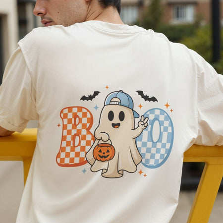 Back view of a person wearing an off-white t-shirt featuring a vibrant cute Halloween ghost and checkered text design.
