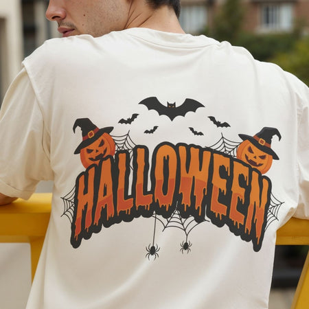 Back view of a person wearing an off-white t-shirt featuring a colorful "Halloween" spooky lettering and witch pumpkin design.
