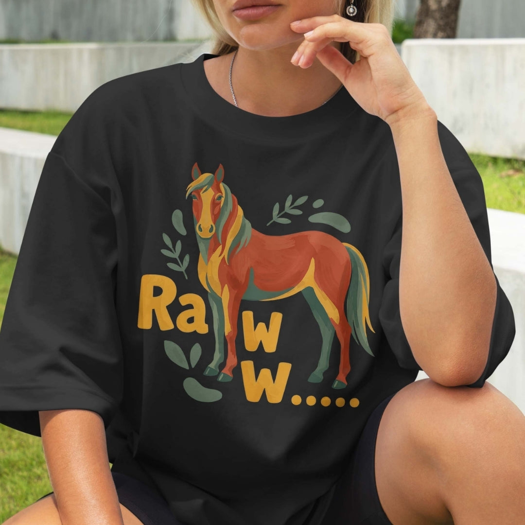 Person wearing a black t-shirt with a colorful horse graphic and 'Raww' text.