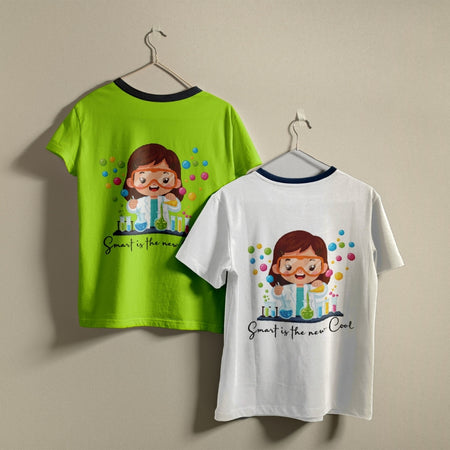Two custom t-shirts, one lime green and one white, hanging on a wall showing a cute girl scientist print design with science lab glassware.