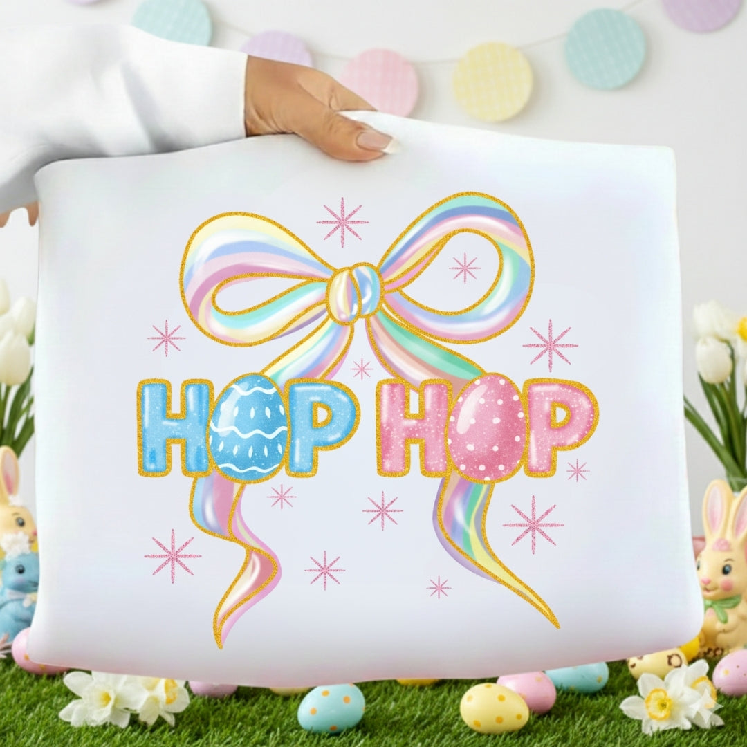Decorative pillow with a colorful bow and 'Hop Hop' text, surrounded by Easter decorations.