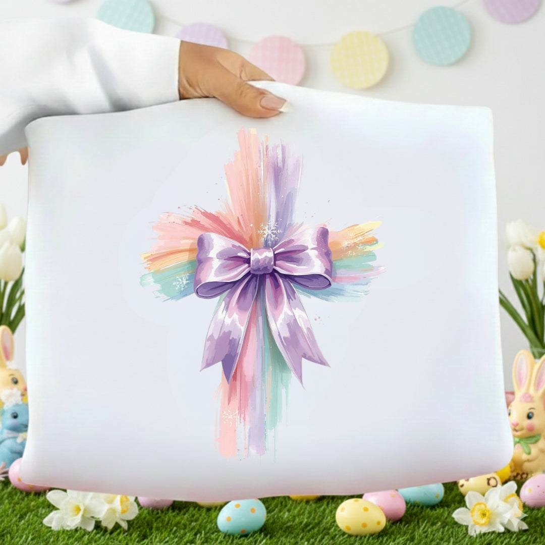 Decorative pillow with a colorful bow on a grassy background with Easter elements.