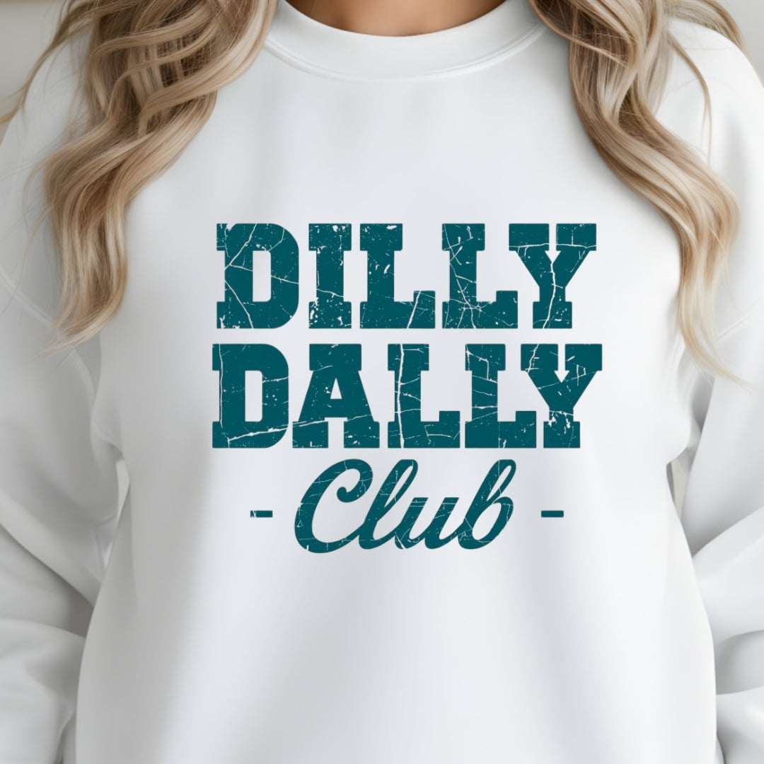 White sweatshirt with 'Dilly Dally Club' text in teal on a person wearing it.