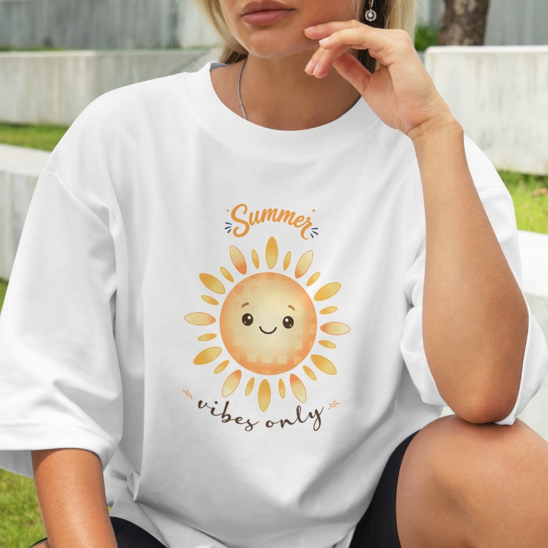 Person wearing a white t-shirt with a sun graphic and 'Summer vibes only' text.