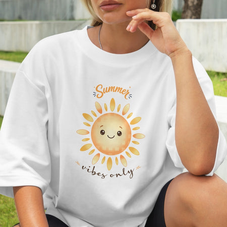 Person wearing a white t-shirt with a sun graphic and 'Summer vibes only' text.