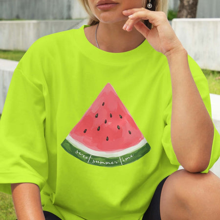 Person wearing a bright green t-shirt with a watermelon design and 'sweet summer time' text.