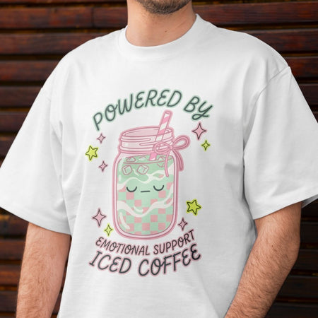 Person wearing a white t-shirt with a colorful design and text.