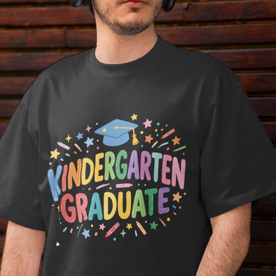 Person wearing a black t-shirt with 'Kindergarten Graduate' text and colorful graphics.