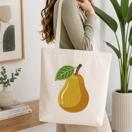 A person holding a cream-colored canvas tote bag featuring the embroidered "Better Together" mushroom couple design.