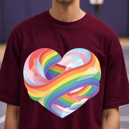 Person wearing a maroon t-shirt with a colorful heart design.
