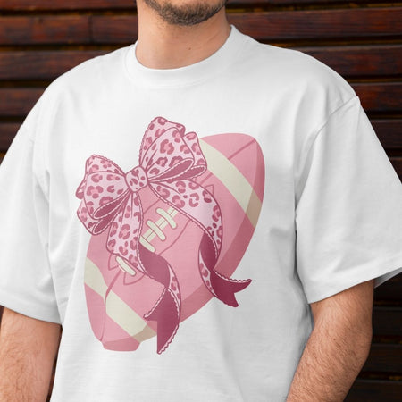 White t-shirt with a pink football and leopard print bow design.