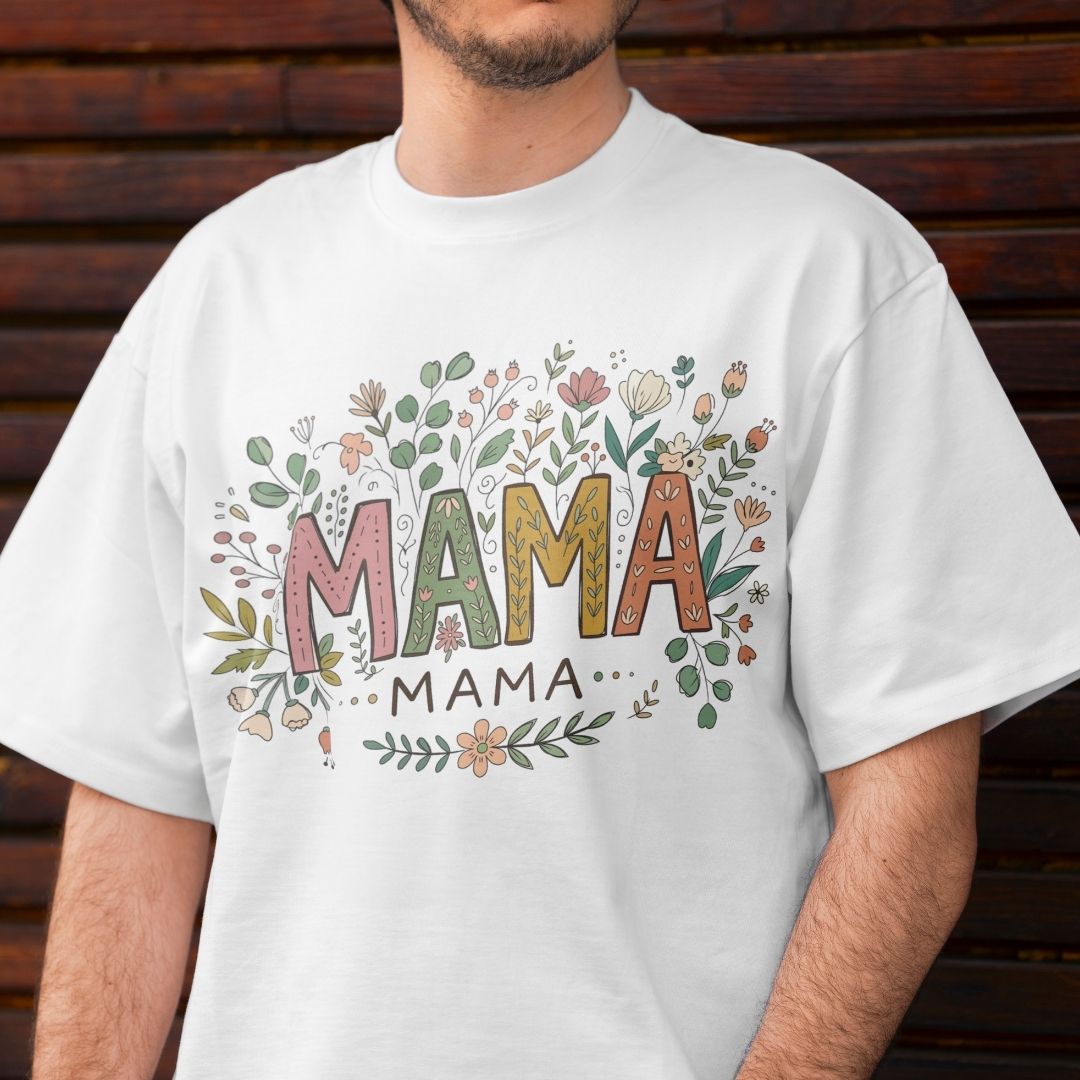 White t-shirt with 'MAMA' design on a wooden background