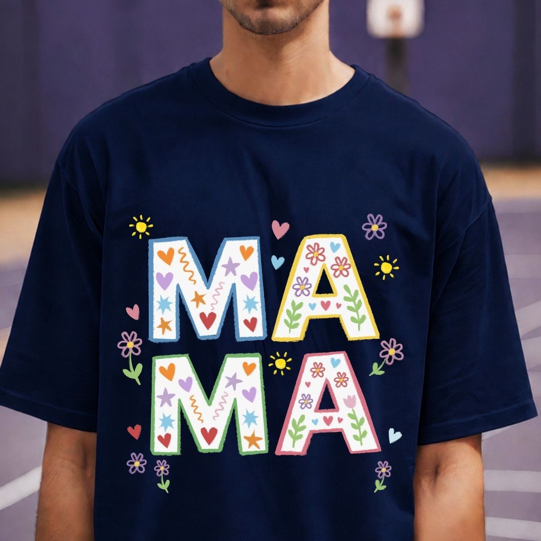 Navy blue t-shirt with colorful 'MAMA' text worn by a person.