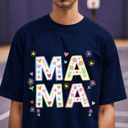 Navy blue t-shirt with colorful 'MAMA' text worn by a person.