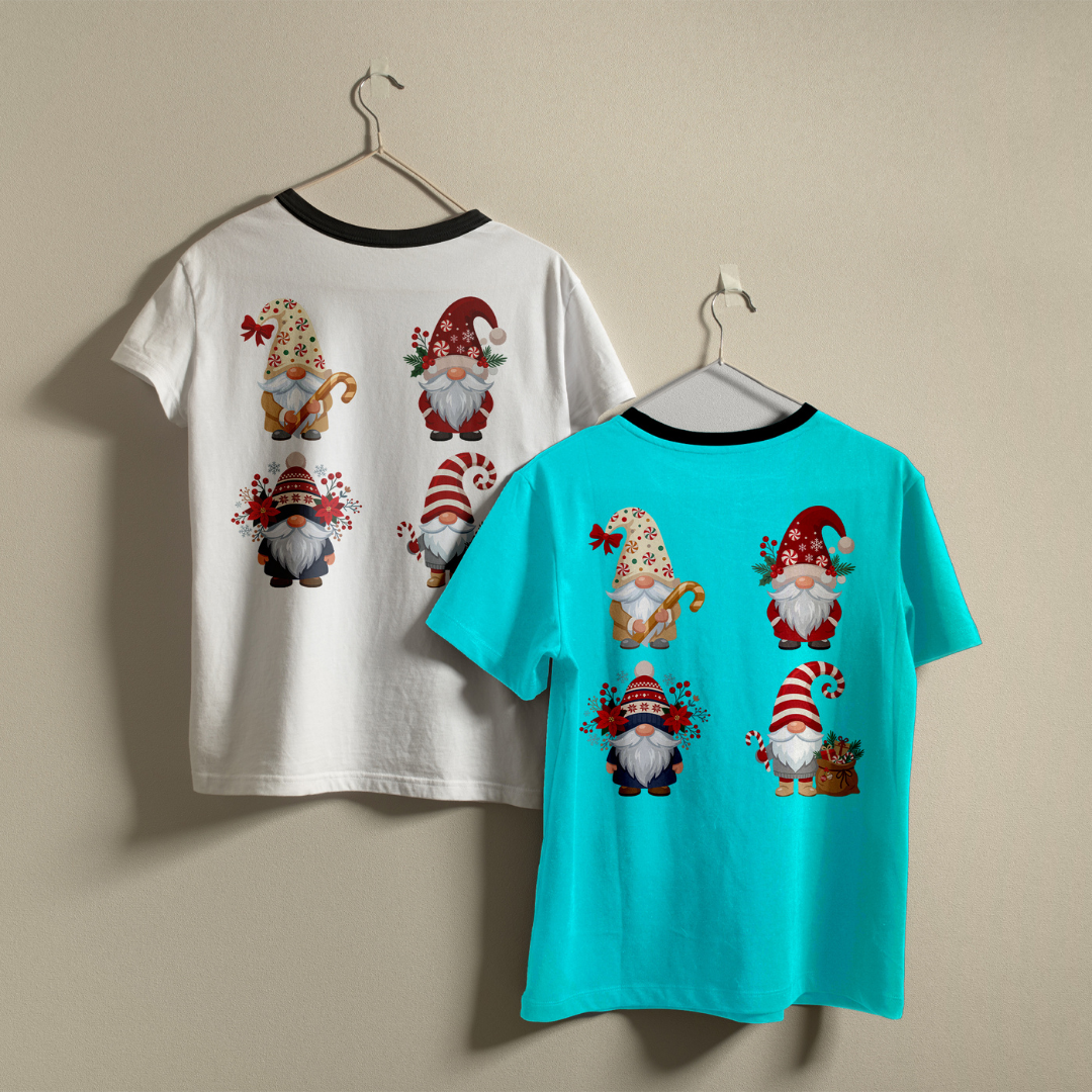 Two t-shirts hanging on a wall—one white and one turquoise—both showcasing the Christmas gnomes holiday print design.