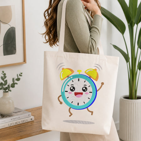 Person holding a tote bag with a cartoon clock design in a home setting.