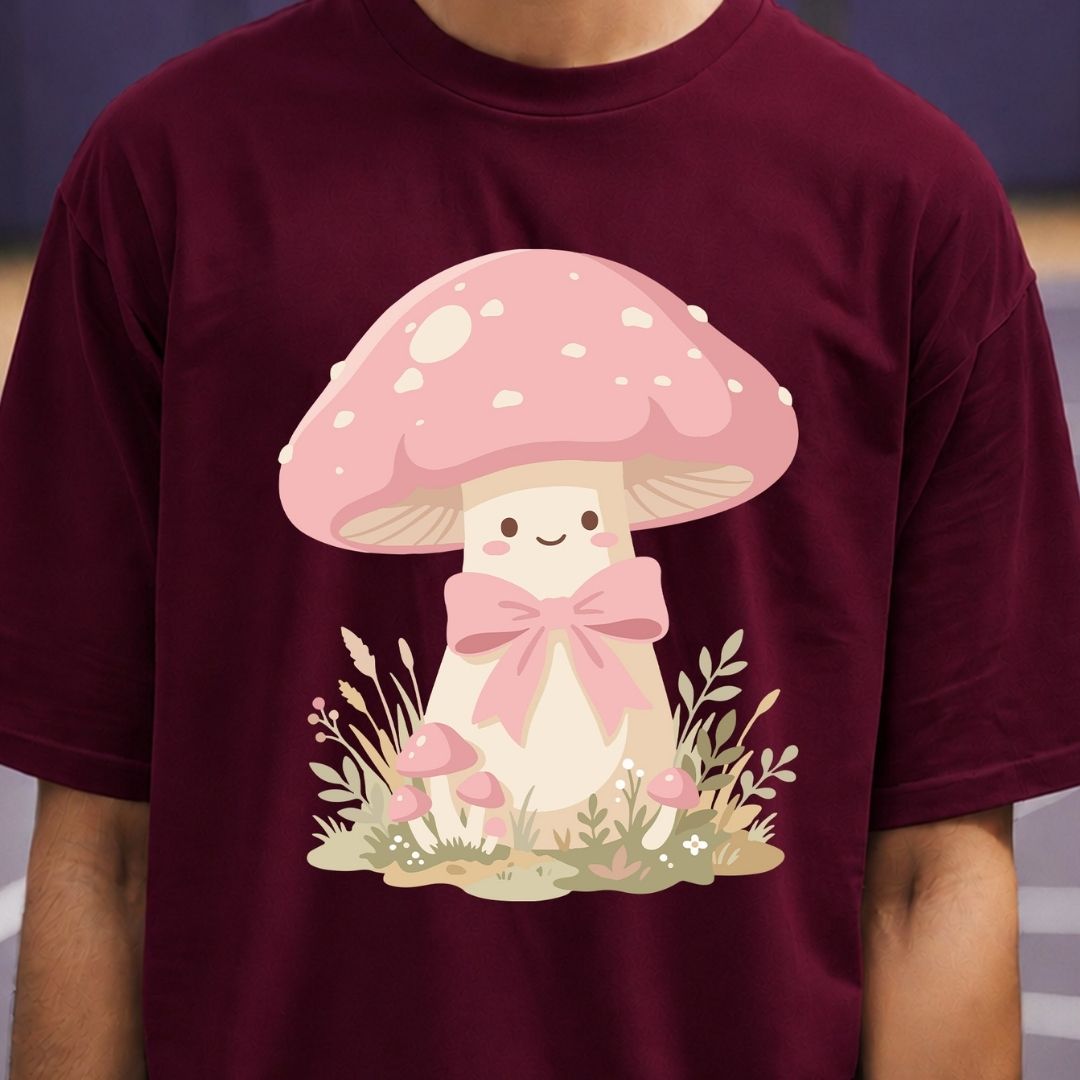 Maroon t-shirt with a cartoon mushroom design featuring a pink bow.