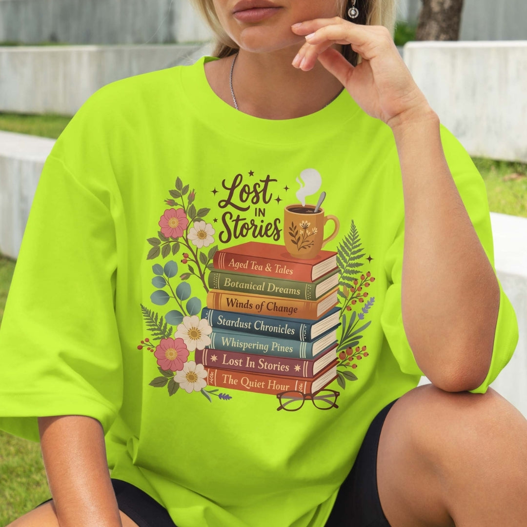 Person wearing a bright green t-shirt with 'Lost in Stories' book-themed design.
