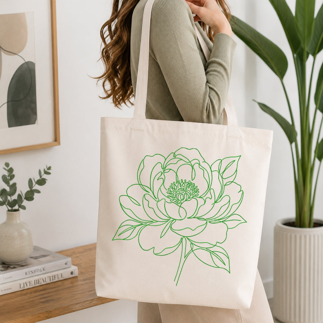 Canvas tote bag with green floral embroidery design