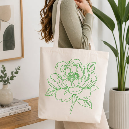 Canvas tote bag with green floral embroidery design