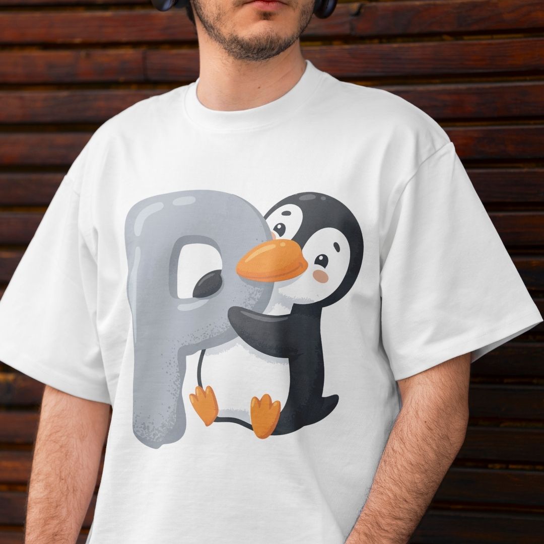 Front view mockup of a man wearing a white t-shirt printed with a light grey letter P graphic being hugged by a cute cartoon penguin.