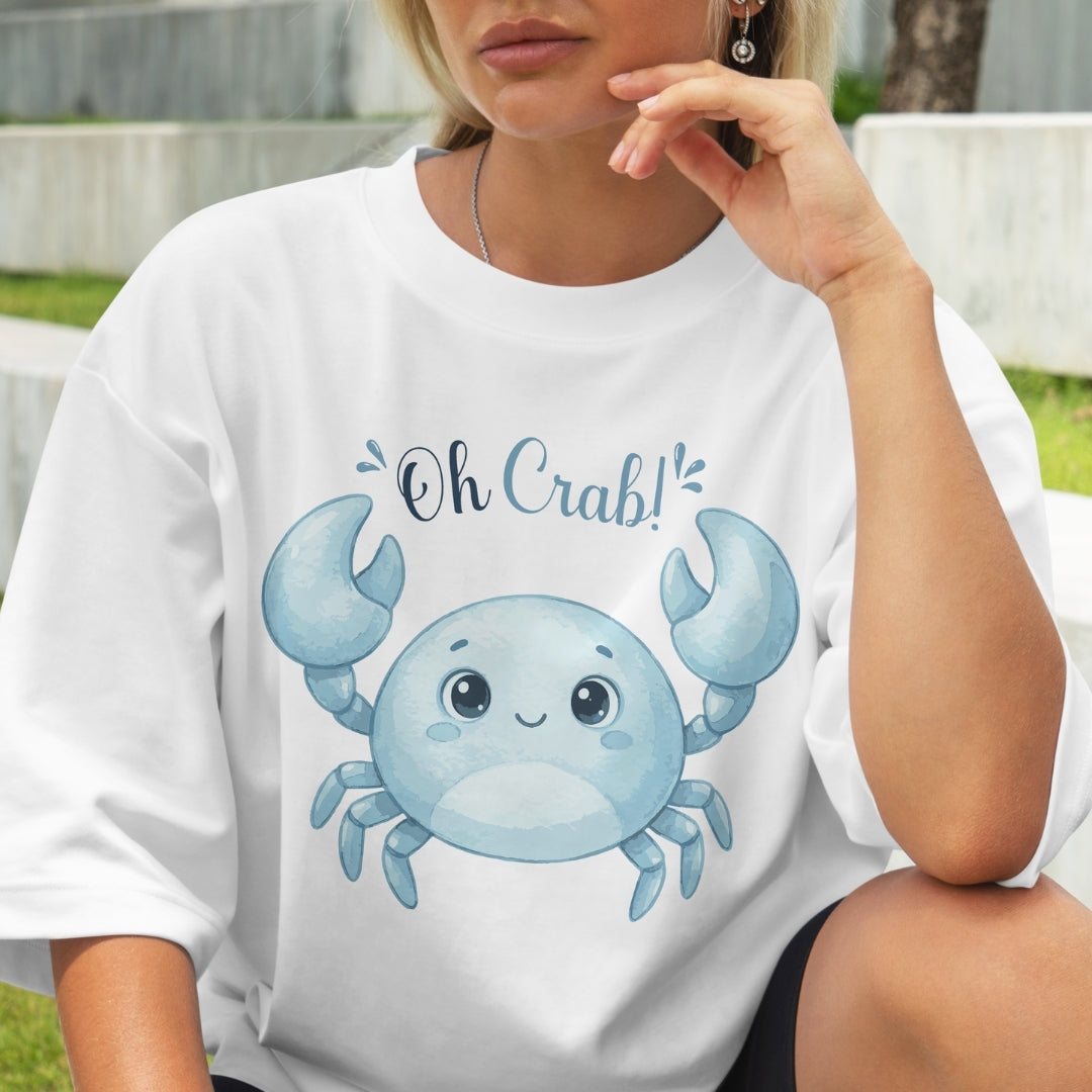 Person wearing a white t-shirt with a blue crab graphic and 'Oh Crab!' text.