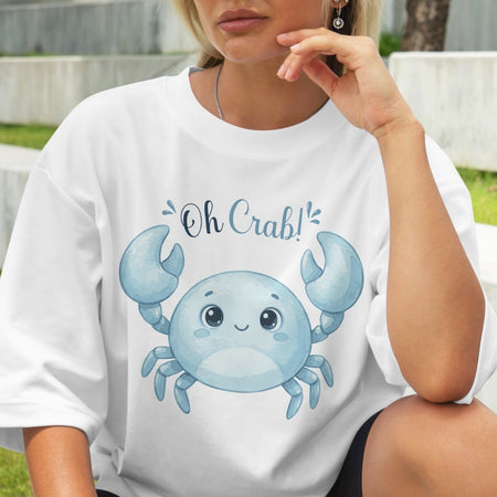 Person wearing a white t-shirt with a blue crab graphic and 'Oh Crab!' text.