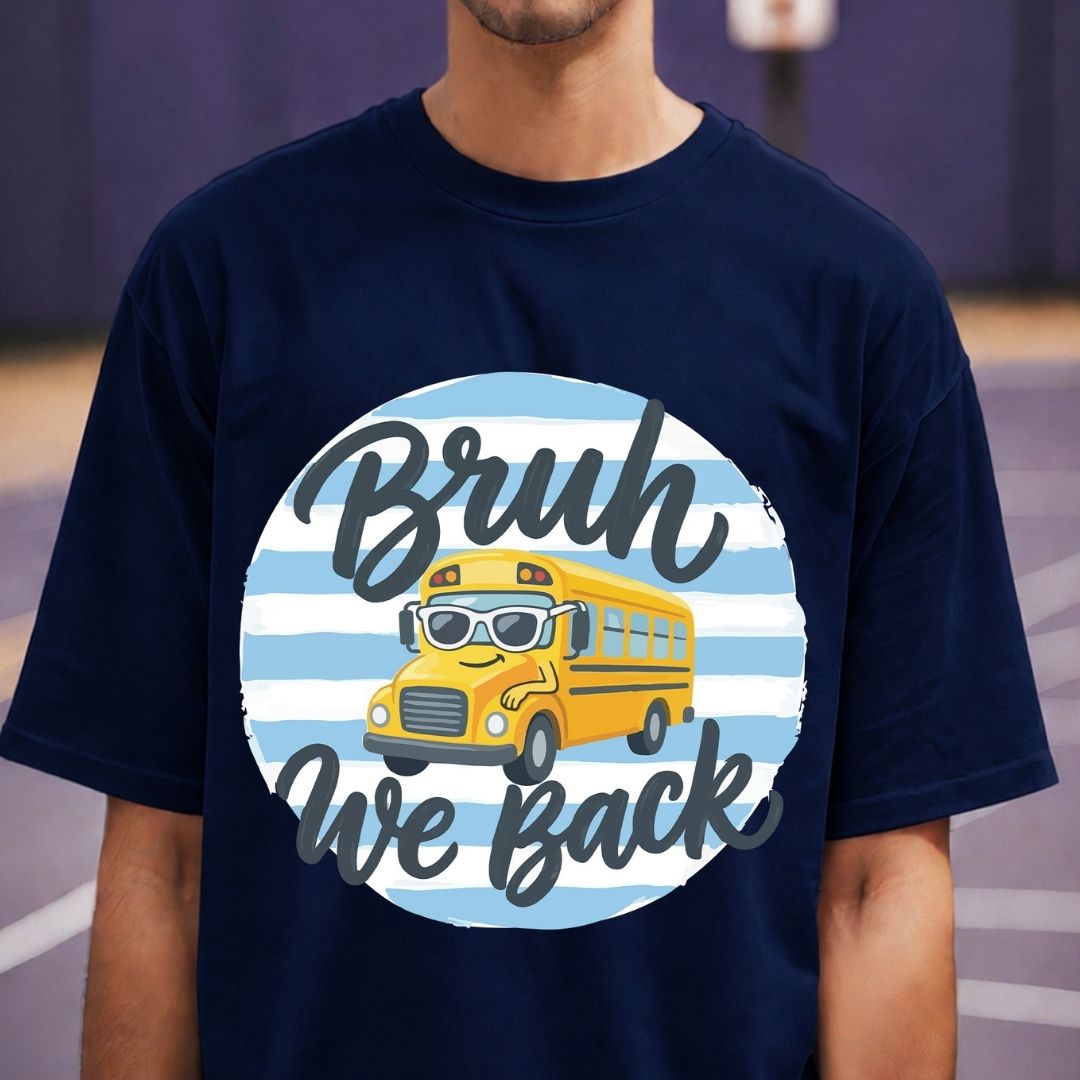 Navy blue t-shirt with a yellow school bus graphic and text on a blurred background