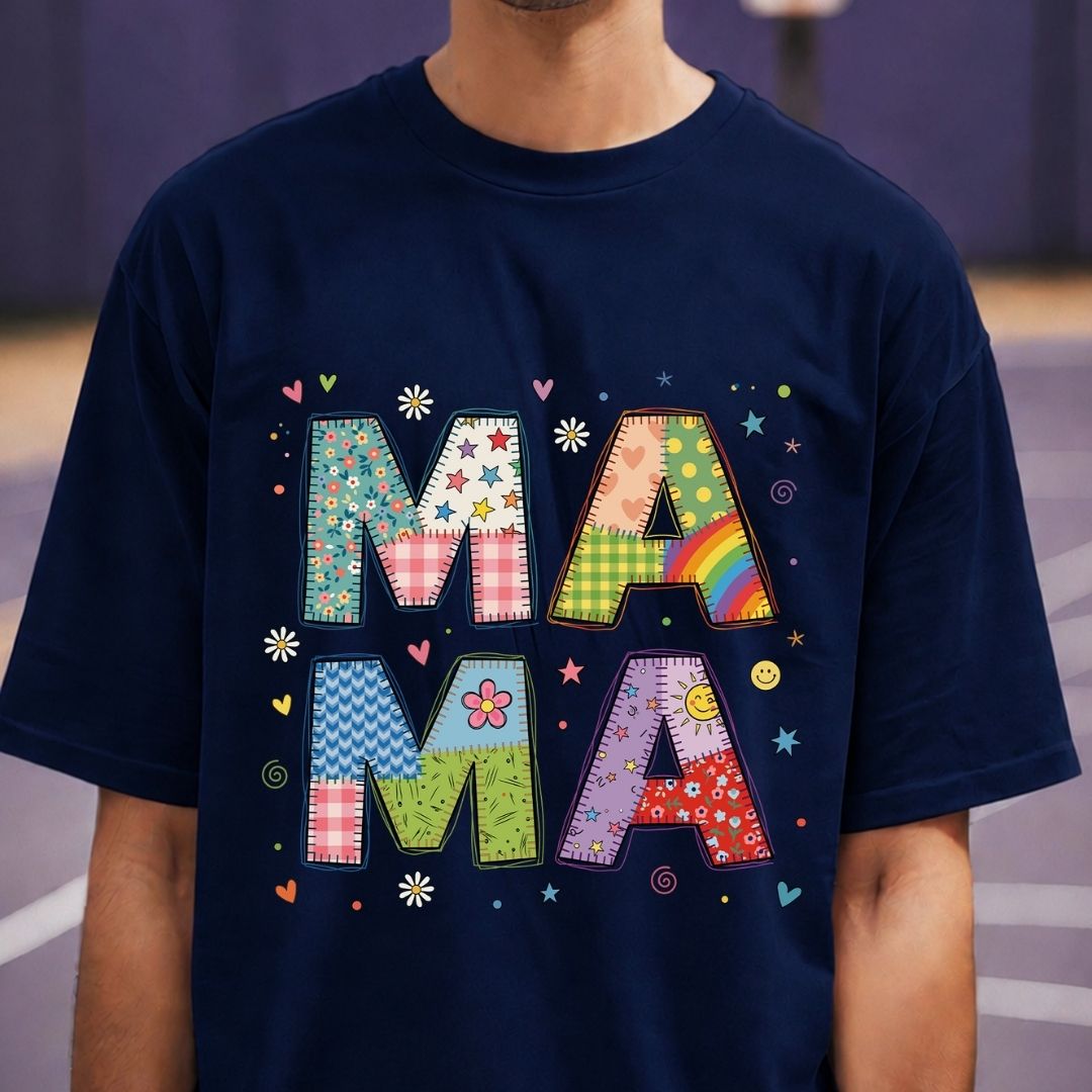 Navy blue t-shirt with colorful 'MAMA' text design on a blurred background