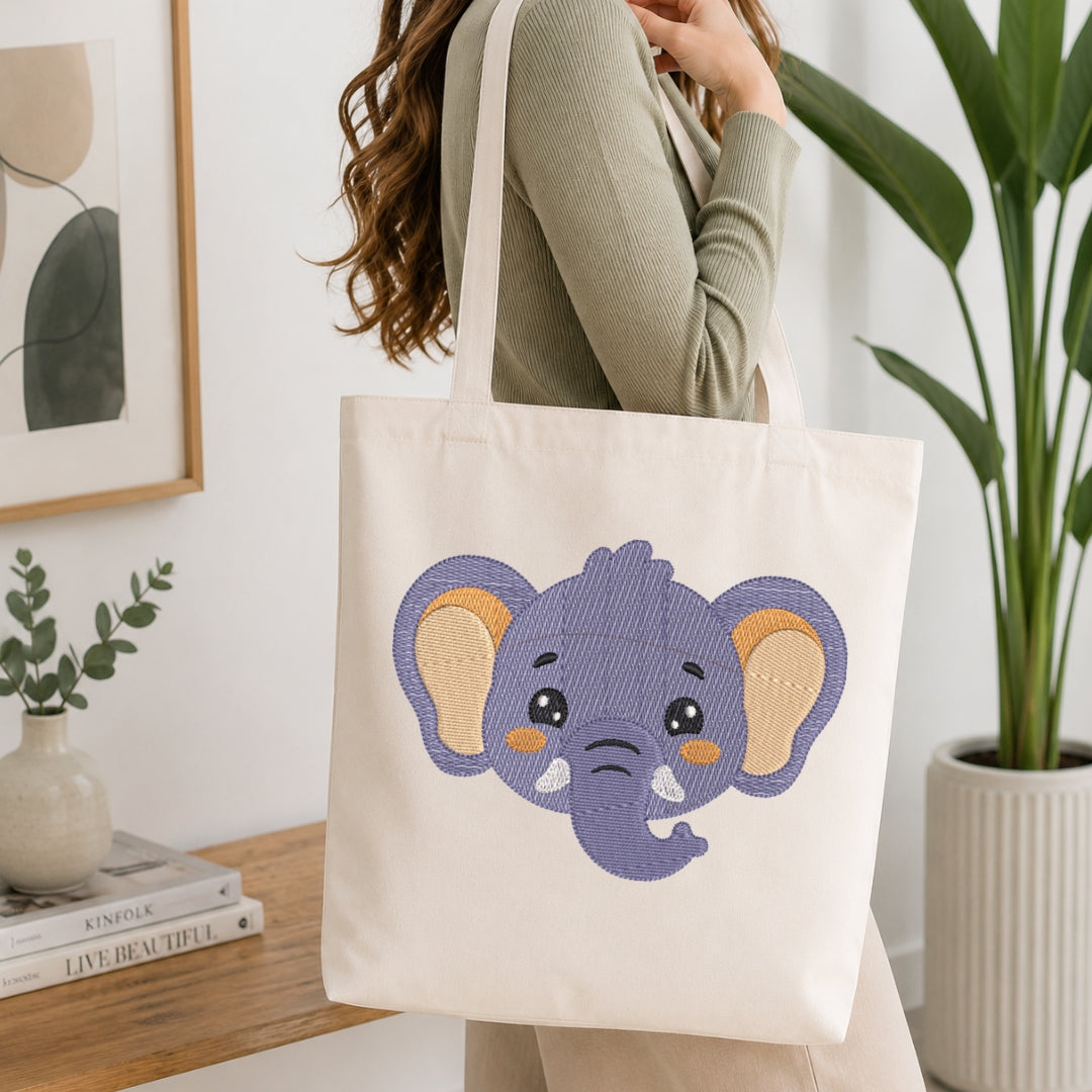 Person holding a tote bag with an elephant design in a home setting.