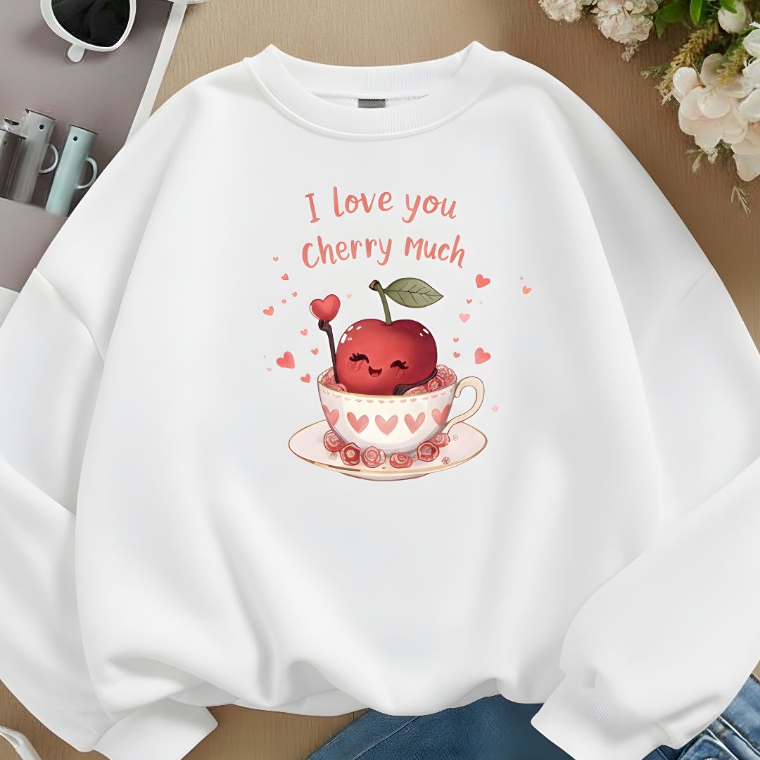 White sweatshirt with cherry-themed design and text 'I Love you Cherry Much' on a neutral background.