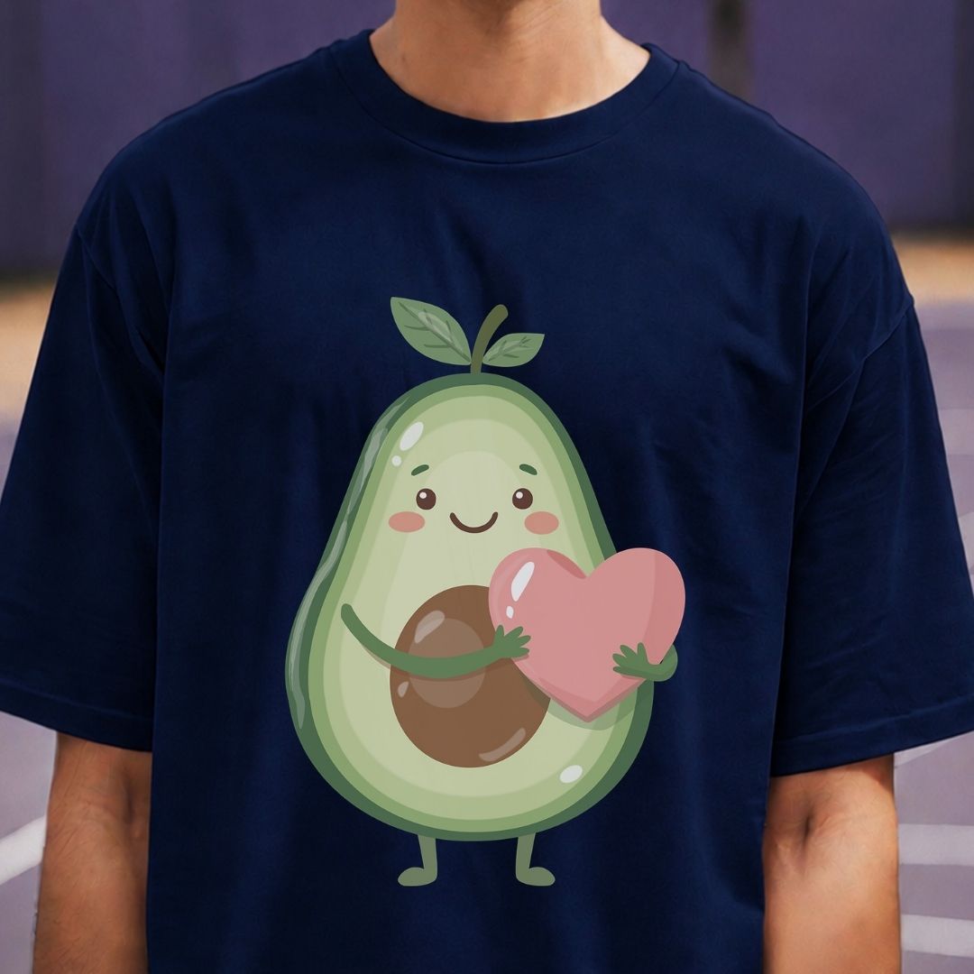 Navy blue t-shirt with a cartoon avocado holding a heart on a blurred background