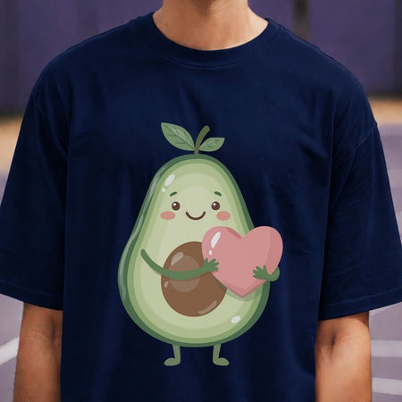 Navy blue t-shirt with a cartoon avocado holding a heart on a blurred background
