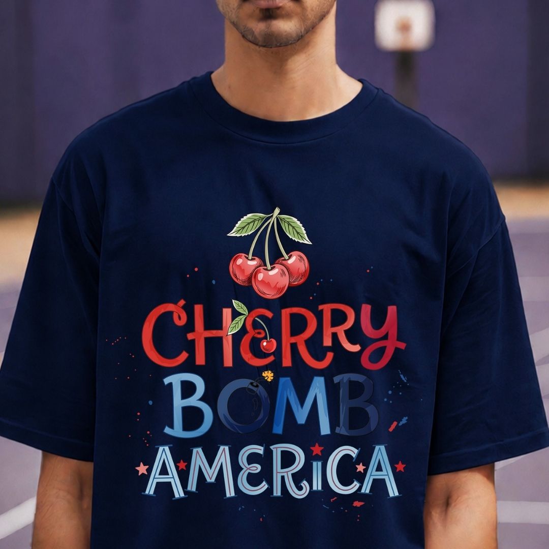 Person wearing a navy blue t-shirt with 'Cherry Bomb America' graphic design.