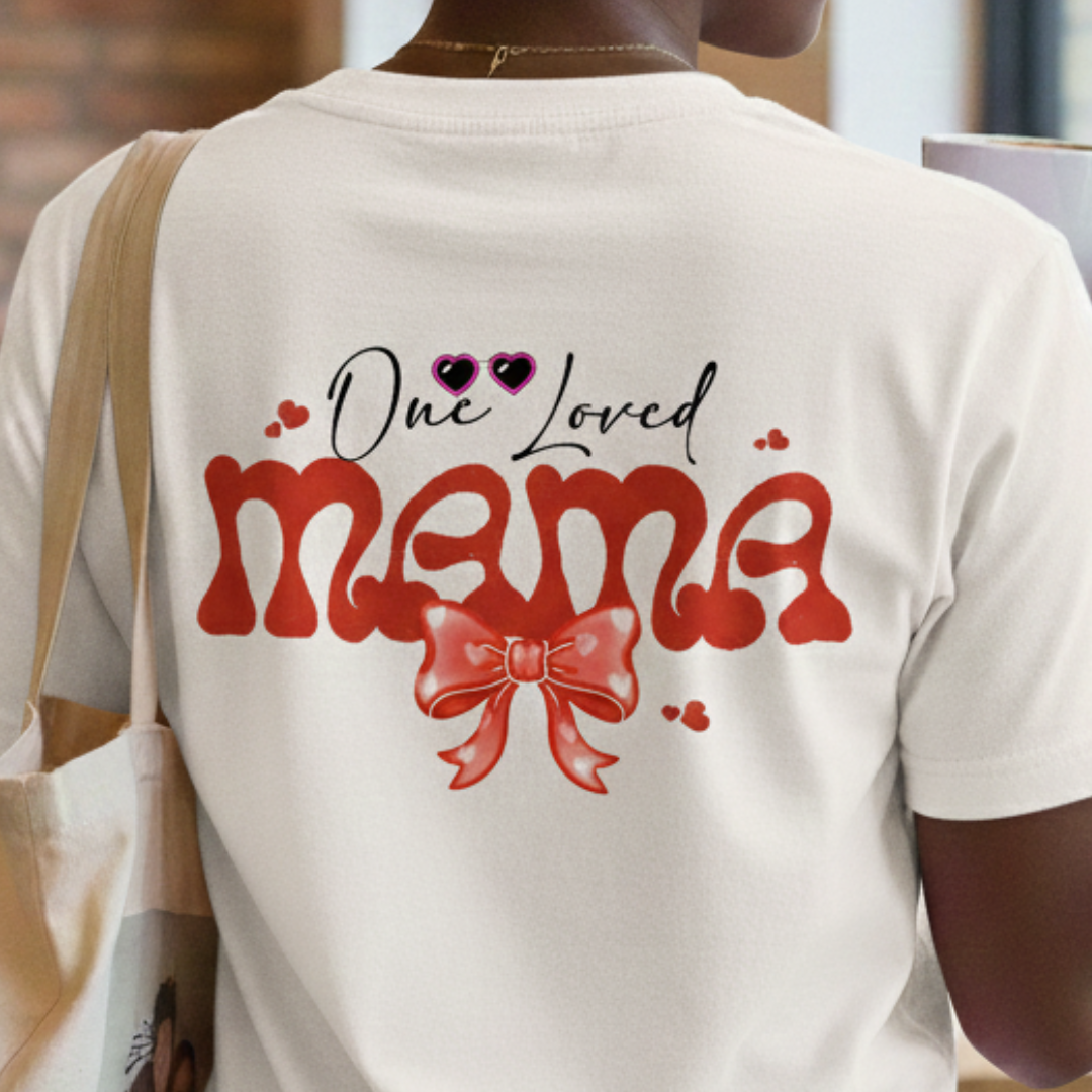 White t-shirt with 'One Loved Mama' text and red bow graphic on the back.