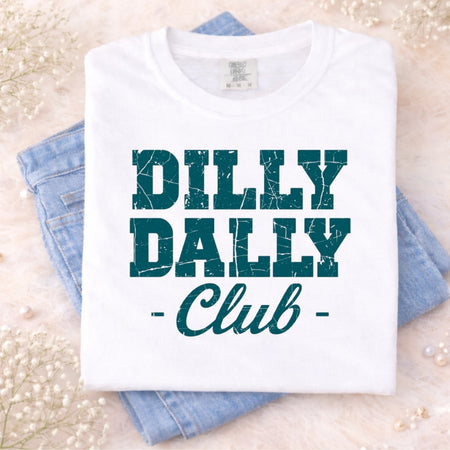 White t-shirt with 'Dilly Dally Club' text on a light background