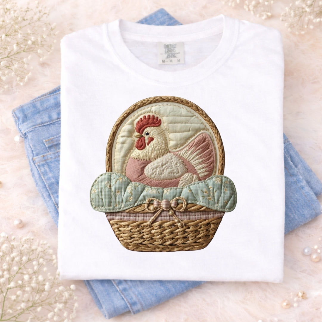 White t-shirt with a rooster design on a light background