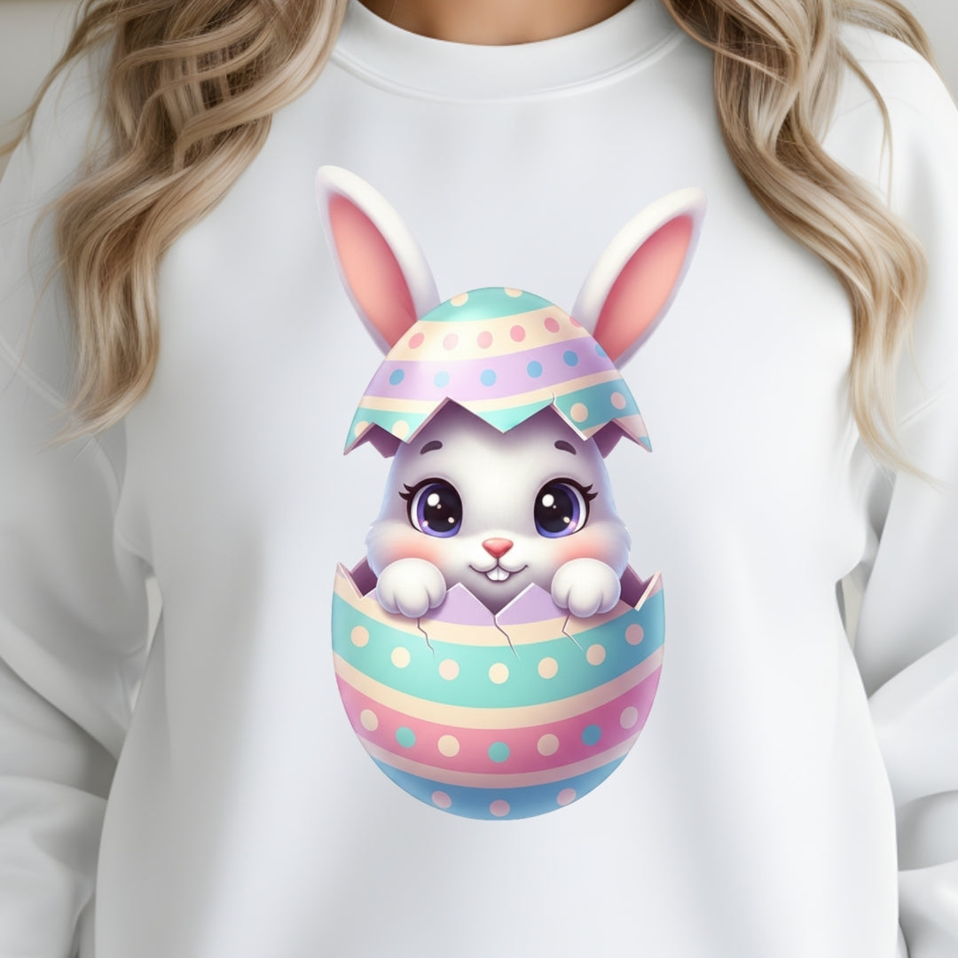 White sweatshirt with a colorful Easter egg design featuring a bunny on a white background.