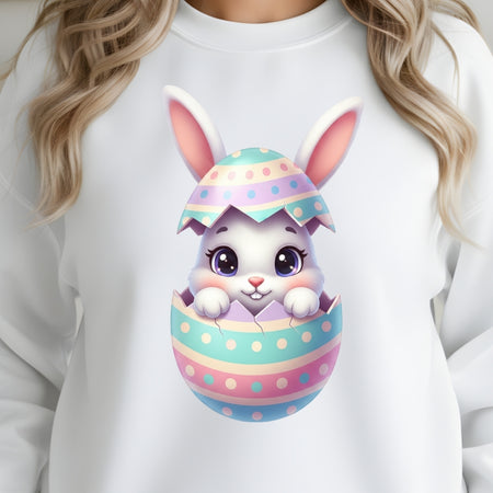 White sweatshirt with a colorful Easter egg design featuring a bunny on a white background.