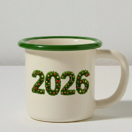 Mug with '2026' in festive design on a plain background