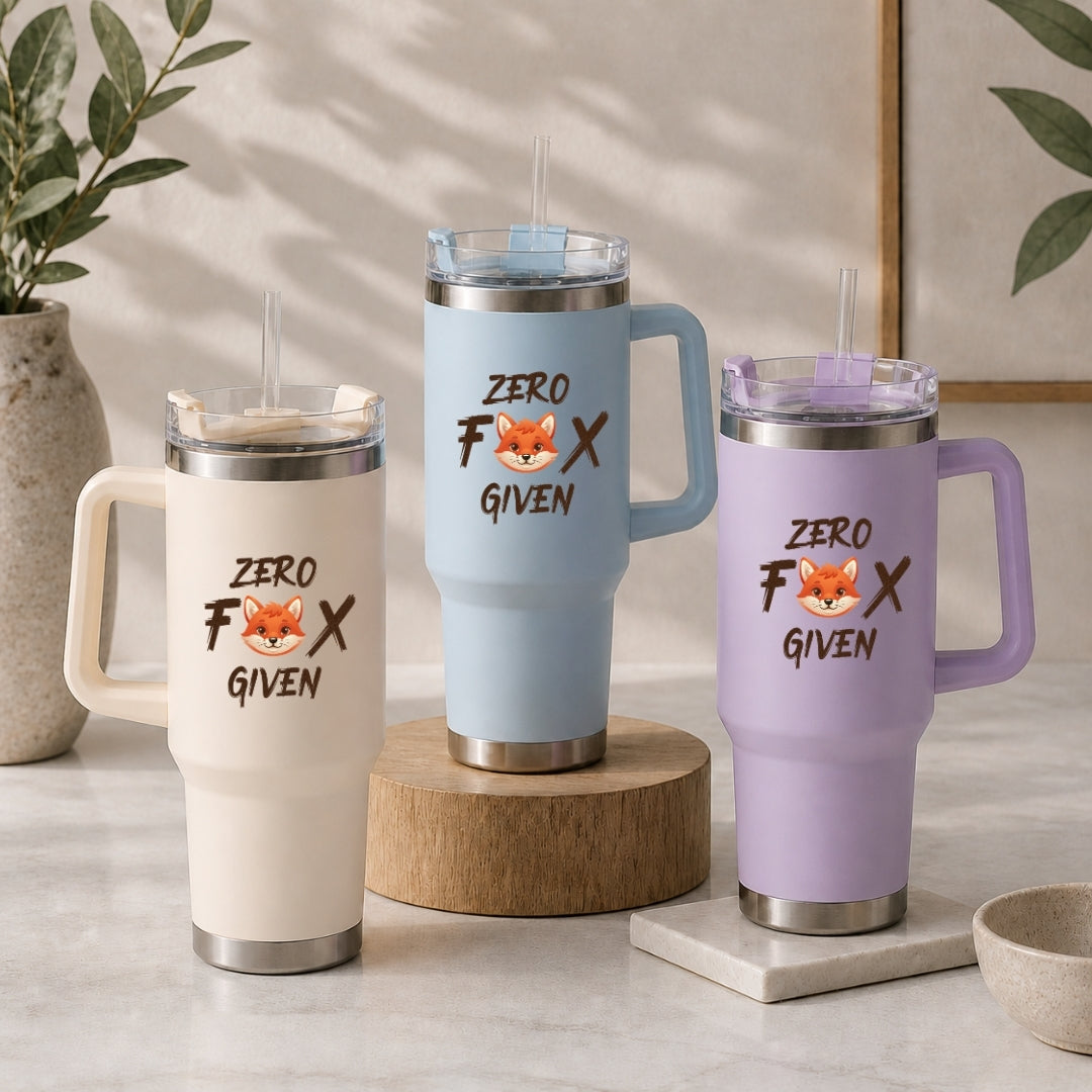 Three insulated travel tumblers with straws in cream, light blue, and lavender, each featuring the witty Zero Fox Given graphic design.