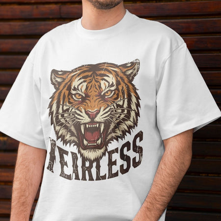 White t-shirt with a tiger graphic and 'HEARLESS' text on a wooden background