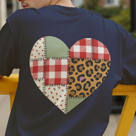 Person wearing a navy blue t-shirt with a heart-shaped pattern on the back.