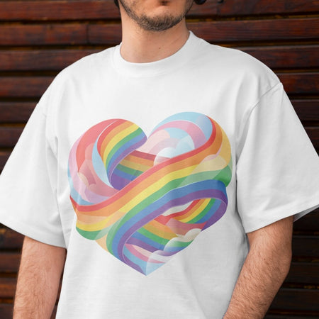 Person wearing a white t-shirt with a colorful heart design against a wooden background