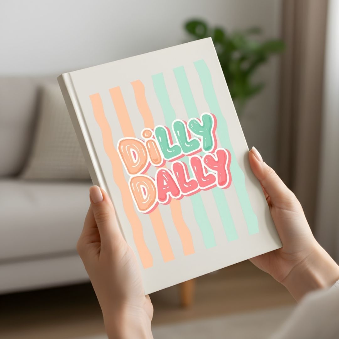 Book titled 'Dilly Dally' held by a person in a home setting