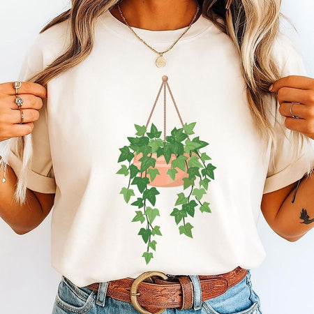 Beige t-shirt mockup showcasing a hanging potted ivy plant digital illustration.